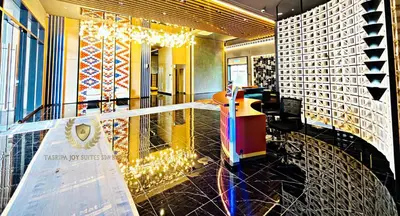 a lobby of a building with a sign on the floor at The Majestic Gen Luxury Suites KLCC in Kuala Lumpur