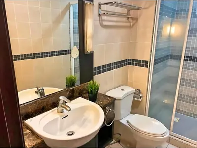 a bathroom with a sink and a toilet and a shower at Anhome Seri bukit Ceylon in Kuala Lumpur