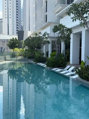 a swimming pool in the middle of a building at Quill Residence - Blissful Urban Condo by Azmila in Kuala Lumpur