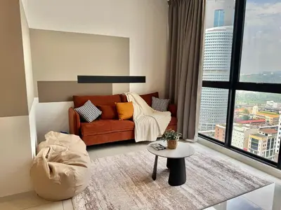 a living room with a couch and a table at Majestic Residence Suite KLCC in Kuala Lumpur