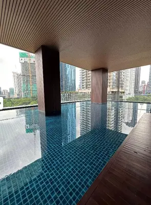 a swimming pool with a view of a city at Bedin Hotels in Kuala Lumpur