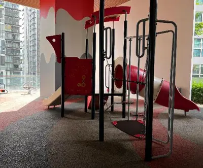 a playground in a building with a red play equipment at Bedin Hotels in Kuala Lumpur