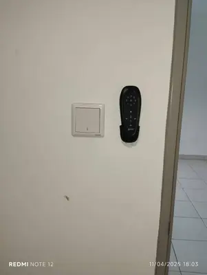 a remote control sitting on top of a door at Flora Residency Setapak in Kuala Lumpur