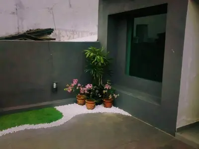 a room with three potted plants and grass at I LUX I-Hotel Kuala Lumpur in Kuala Lumpur