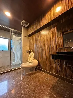 a bathroom with a toilet and a shower in a room at Triple B Hotel in Kuala Lumpur