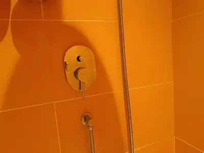 a shower in a bathroom with a phone on the wall at Penthouse-Bukit Bintang in Kuala Lumpur