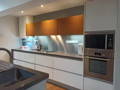 a kitchen with a sink and a microwave at Penthouse-Bukit Bintang in Kuala Lumpur