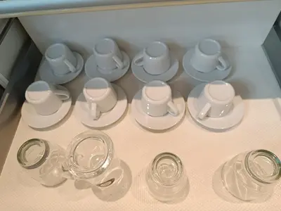 a bunch of cups and saucers in a drawer at Penthouse-Bukit Bintang in Kuala Lumpur