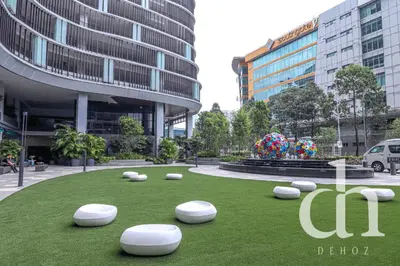 a grassy area with white objects in a city at Trion KL Residence by Dehoz Suites in Kuala Lumpur