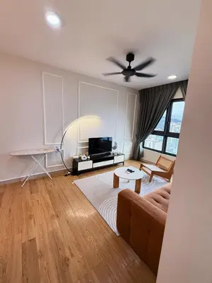 a living room with a couch and a ceiling fan at M Vertica KL Cheras in Kuala Lumpur