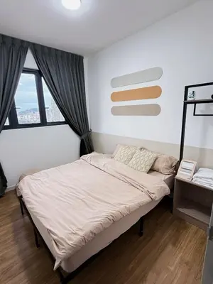 a bedroom with a bed and a window at M Vertica KL Cheras in Kuala Lumpur