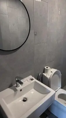 a bathroom with a sink and a mirror and a toilet at M Vertica KL Cheras in Kuala Lumpur