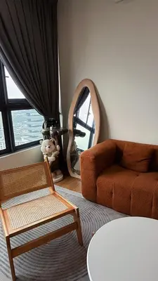 a living room with a couch and a mirror at M Vertica KL Cheras in Kuala Lumpur