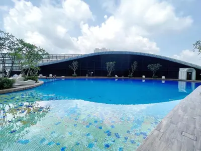 a large swimming pool in front of a building at Arte Mont Kiara By Comfortcorner in Kuala Lumpur