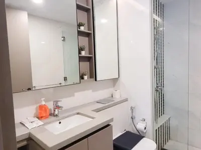 a bathroom with a sink and a mirror at Eaton Residence KLCC Kuala Lumpur in Kuala Lumpur