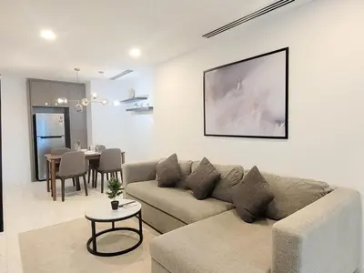 a living room with a couch and a table at Eaton Residence KLCC Kuala Lumpur in Kuala Lumpur