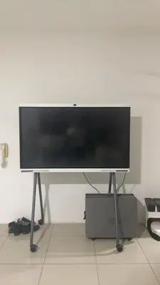 a flat screen tv on a stand in a room at The nest apartment in Kuala Lumpur