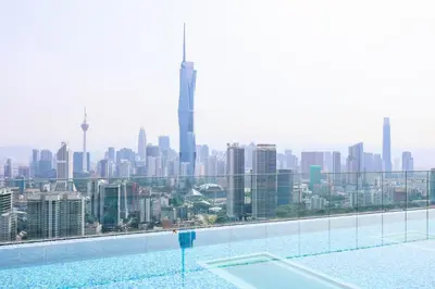 a swimming pool with a view of a city at Riveria City Home Plus in Kuala Lumpur