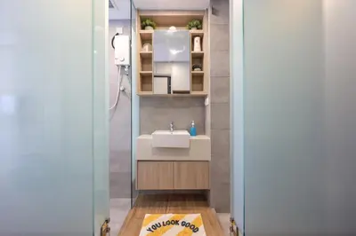a bathroom with a sink and a mirror at Riveria City Home Plus in Kuala Lumpur