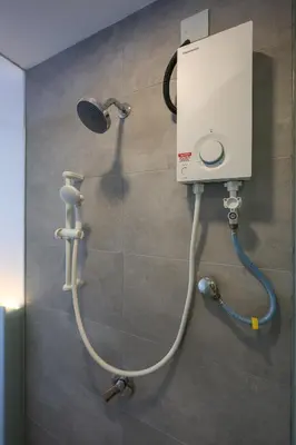 a shower in a bathroom with a shower at Riveria City Home Plus in Kuala Lumpur