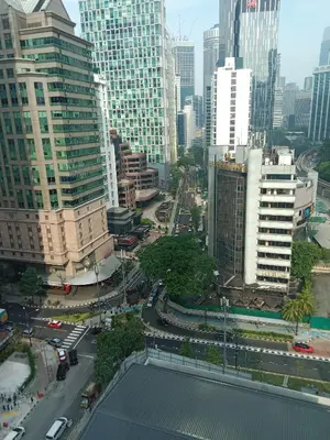 a view of a city with traffic and buildings at Vortex Suites KLCC by Comfy Stay in Kuala Lumpur