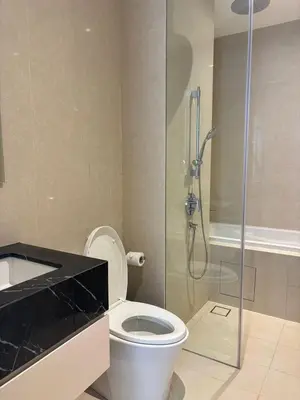 a bathroom with a toilet and a glass shower at Pavilion Ceylon Hill Luxury suit Bukit Bintang by cupidhome in Kuala Lumpur