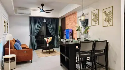 a dining room and living room with a table and chairs at The Atrium at Jalan Ampang by OKBnB- Modern Cozy 3 Bedroom Apartment 4 Mins to KLCC in Kuala Lumpur