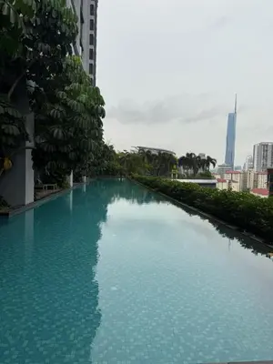 a large pool of blue water in a city at Trion KL Residence By CozyNest in Kuala Lumpur