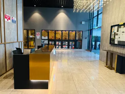 a lobby with a counter in a building at Trion KL Residence By CozyNest in Kuala Lumpur