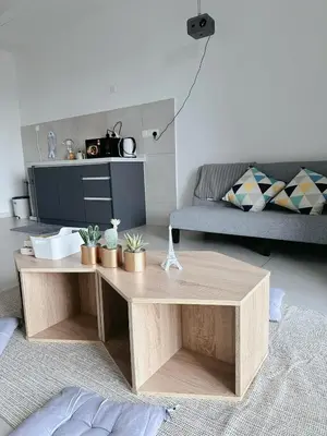 a living room with a coffee table and a couch at Netflix - City View Pano Studio with Skypool, Free parking and 5 mins to MRT in Kuala Lumpur