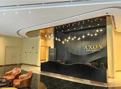 a lobby with chairs and aazon sign on the wall at Bukit Bintang in Kuala Lumpur