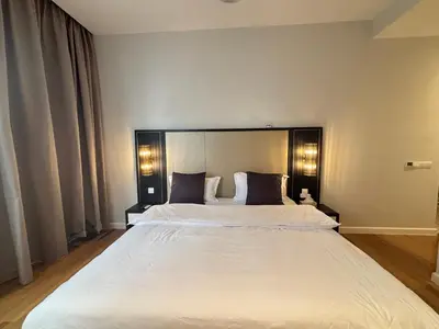 a bedroom with a large white bed with two pillows at Pavilion Ceylon Hill Luxury apartment Bukit Bintang by cupidhome in Kuala Lumpur