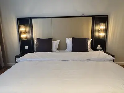 a large white bed in a room with two pillows at Pavilion Ceylon Hill Luxury apartment Bukit Bintang by cupidhome in Kuala Lumpur