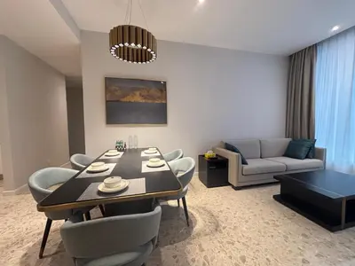 a living room with a dining table and a couch at Pavilion Ceylon Hill Luxury apartment Bukit Bintang by cupidhome in Kuala Lumpur