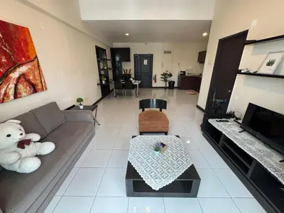 a living room with a couch and a teddy bear at KLCC Pavilion 127 Alor Street Ceylon KL Bukit Bintang 5 Pax in Kuala Lumpur