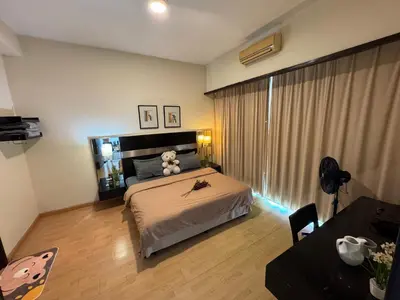a bedroom with a bed with a teddy bear on it at KLCC Pavilion 127 Alor Street Ceylon KL Bukit Bintang 5 Pax in Kuala Lumpur