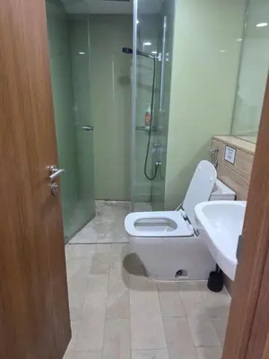 a bathroom with a shower and a toilet and a sink at Vortex suites klcc by musab in Kuala Lumpur