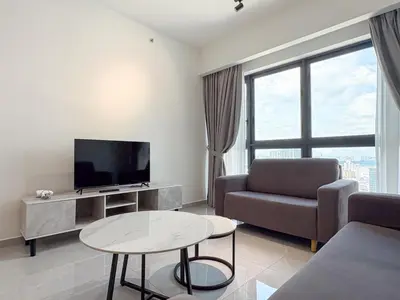 a living room with a couch and a tv and a table at KLCC Agile 雅居乐民宿-吉隆坡 I 双子塔 I Walking distance to MRT & TRX & Bukit Bintang I 中英马客服 Chinese English Malay in Kuala Lumpur
