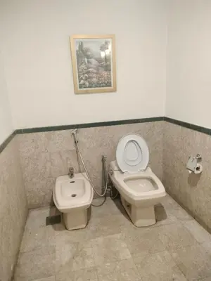 a bathroom with a toilet and a bidet at Night suite apartment at time square kl in Kuala Lumpur