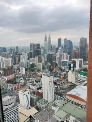an aerial view of a city with tall buildings at Night suite apartment at time square kl in Kuala Lumpur