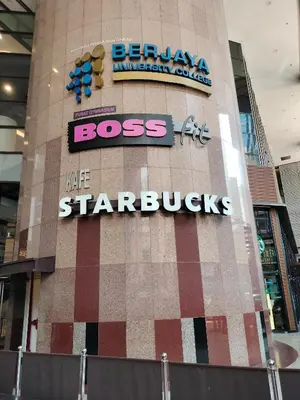 a building with a sign on the side of it at Night suite apartment at time square kl in Kuala Lumpur