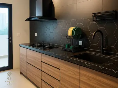 a kitchen with a sink and a counter top at Family Suites Reizz Ampang 2R2B in Kuala Lumpur