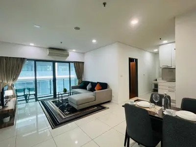 a living room with a couch and a table at Mercu summer suits 1BR luxury couple room free Netflix 5mint WD KLCC by Top R in Kuala Lumpur