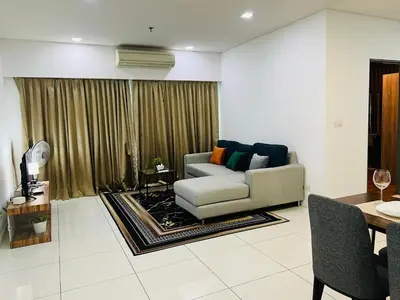 a living room with a couch and a table at Mercu summer suits 1BR luxury couple room free Netflix 5mint WD KLCC by Top R in Kuala Lumpur