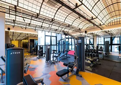 a gym with a lot of treadmills and machines at Scarletz Suite KLCC 2 in Kuala Lumpur