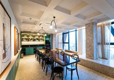 a dining room with a long table and chairs at Scarletz Suite KLCC 2 in Kuala Lumpur