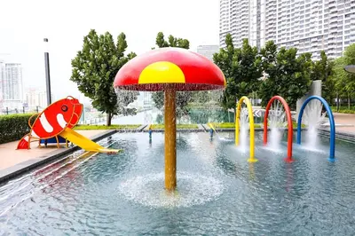a water park with a playground with a umbrella at Stylish M Vertica 3 Bedroom Walk to MRT Velocity Mall in Kuala Lumpur