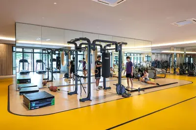 a group of people in a gym with machines at Stylish M Vertica 3 Bedroom Walk to MRT Velocity Mall in Kuala Lumpur