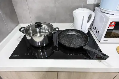 a pot and pan on a stove in a kitchen at Stylish M Vertica 3 Bedroom Walk to MRT Velocity Mall in Kuala Lumpur