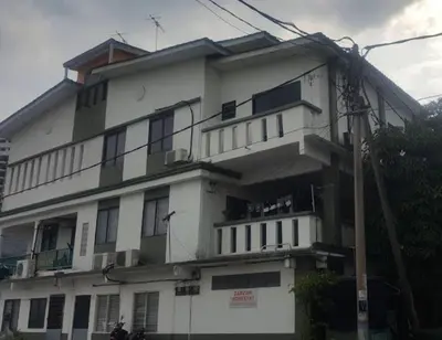 a large white building with a lot of windows at Zam Zam Homestay in Kuala Lumpur